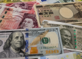 Markets hold steady as investors await US data and central bank signals