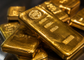 Gold trades lower despite geopolitical risks as higher yields cap gains