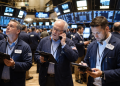 Dow opens higher as chip stocks slide, S&P 500 dips on Iran tensions